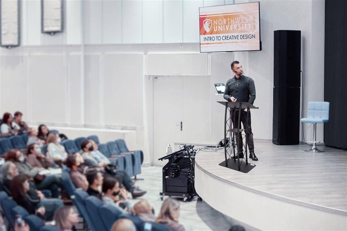 Displays2go Black Aluminum and Steel Truss Lectern with Curved Design and Built-in Shelf, 47-Inch Tall, Textured Finish (LCTTACBK)